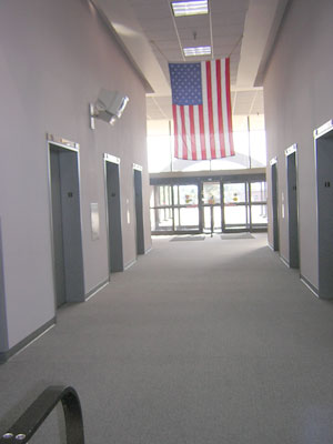 a typically quiet government hall. Post 9-11. The flag will save us.